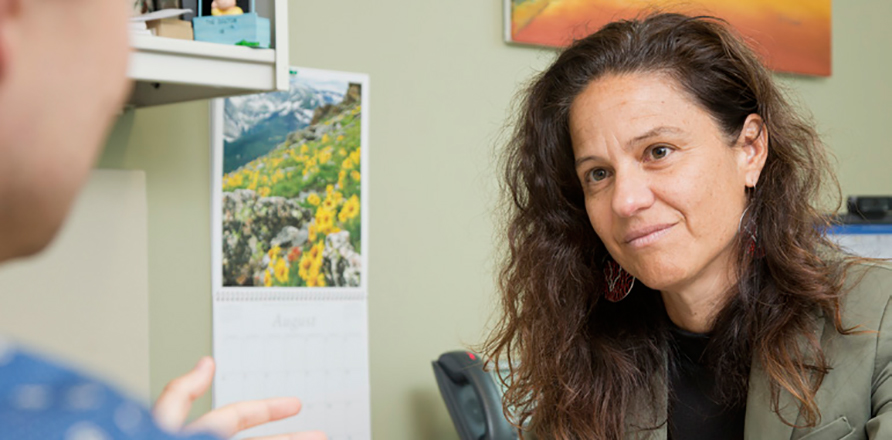 Photo of doctor listening to patient